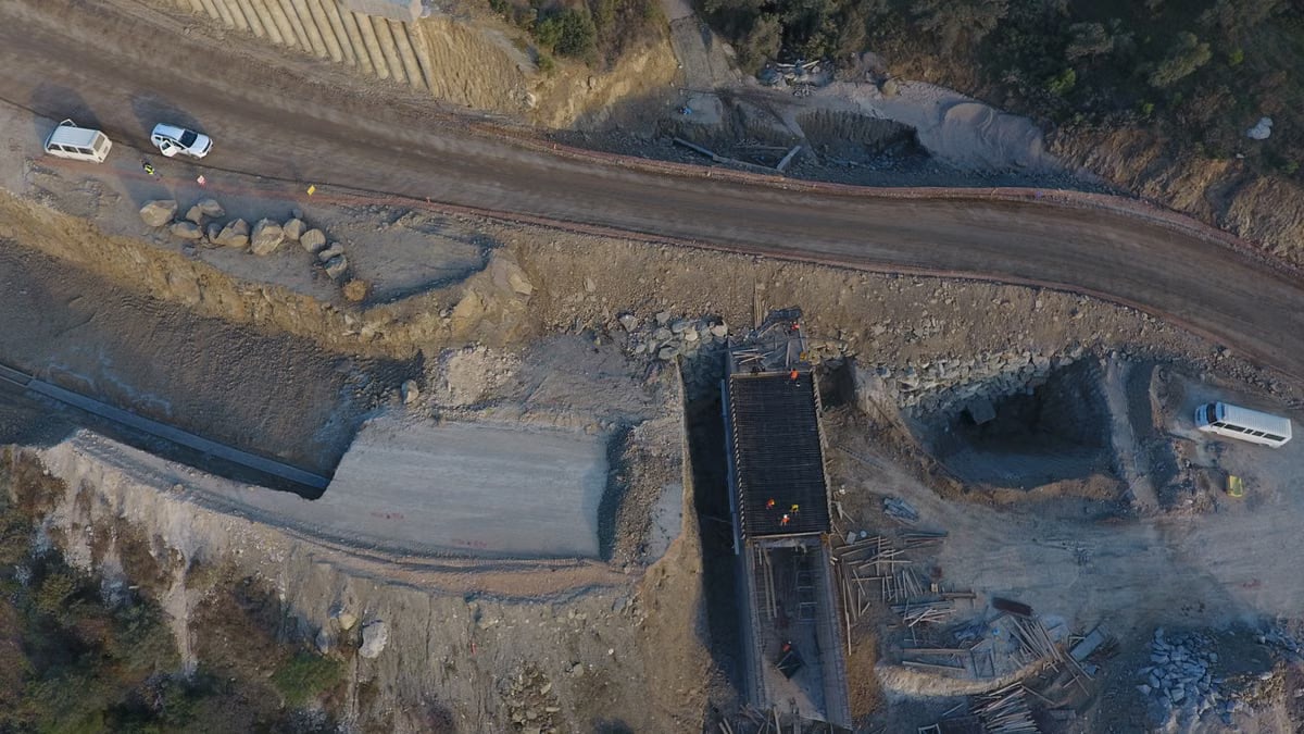 Aerial view of a construction site with road and vehicles in Küçükçetmi, Çanakkale, Turkey.